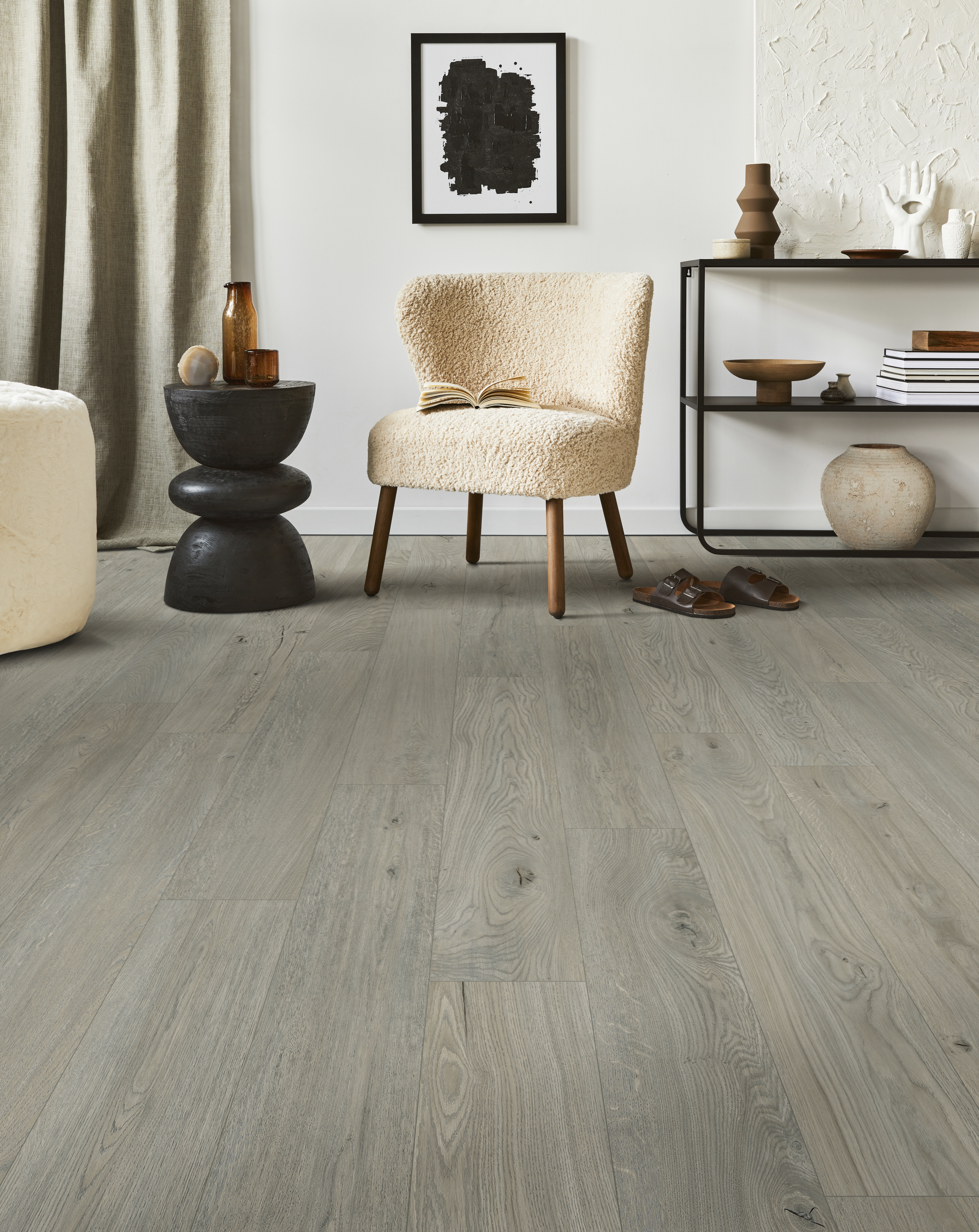 Creative composition of cozy living room interior design with mock up poster frame, fluffy armchair, coffee table, commode and personal accessories. Modern classic style. Template.